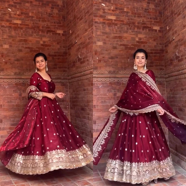 Elegance in Maroon Against Urban Backdrop