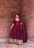Elegance in Maroon Against Urban Backdrop