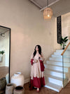 Graceful Presence Ascending the Staircase