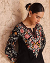 Timeless Black Attire with Floral Accents