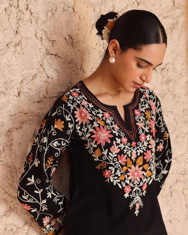 Timeless Black Attire with Floral Accents