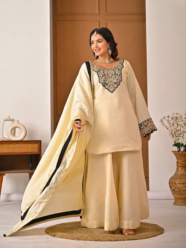 Chic Cream Attire Featuring Bold Black Details