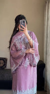 Confident Elegance in a Purple Suit