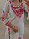 Stylish White Ensemble with Floral Accents