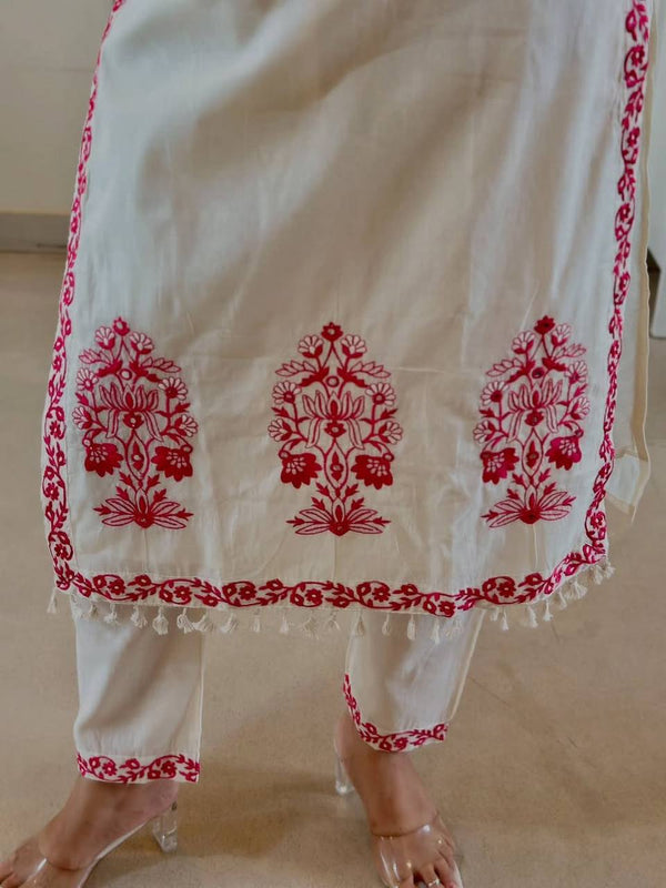Stylish White Ensemble with Floral Accents