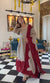 Elegant Woman in Striking Dress Pose