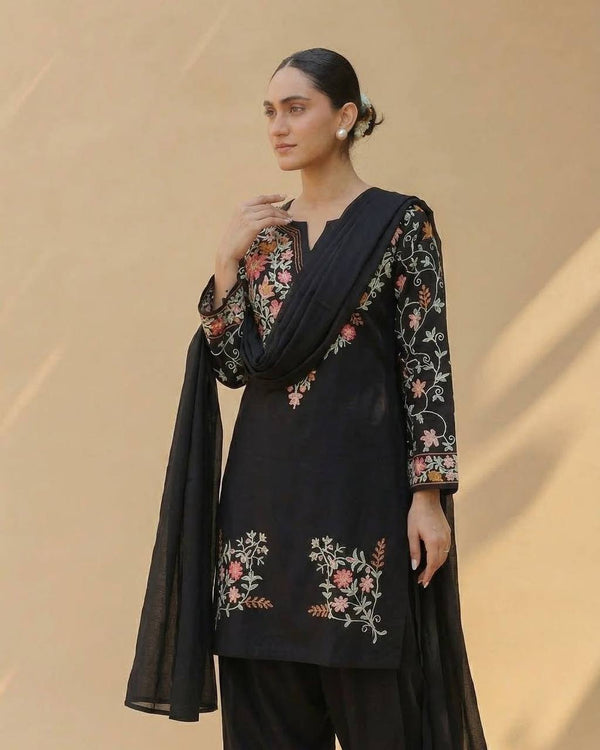 Timeless Black Attire with Floral Accents