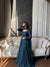 Elegance in Blue on a Cozy Couch