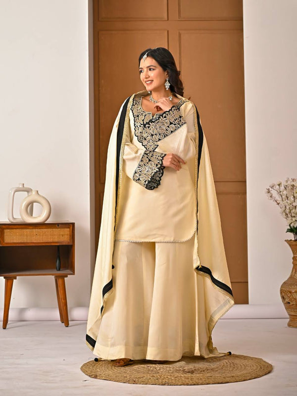 Chic Cream Attire Featuring Bold Black Details